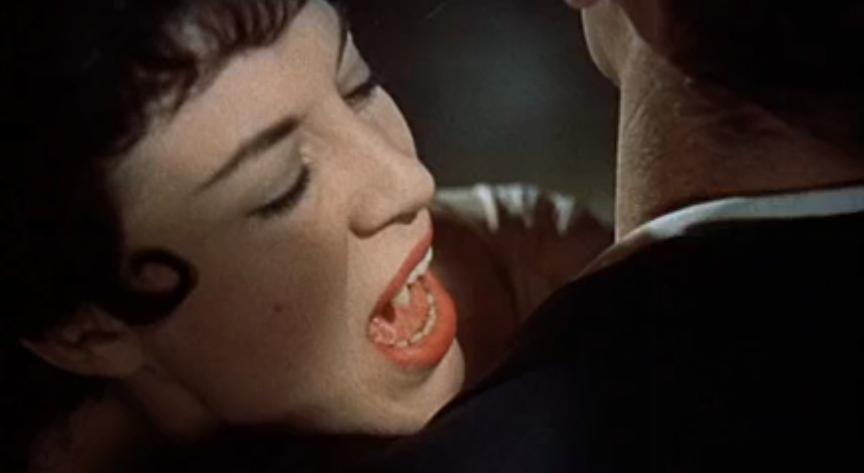 One of Dracula's (unnamed) brides, asking Harker for help … and about to feed