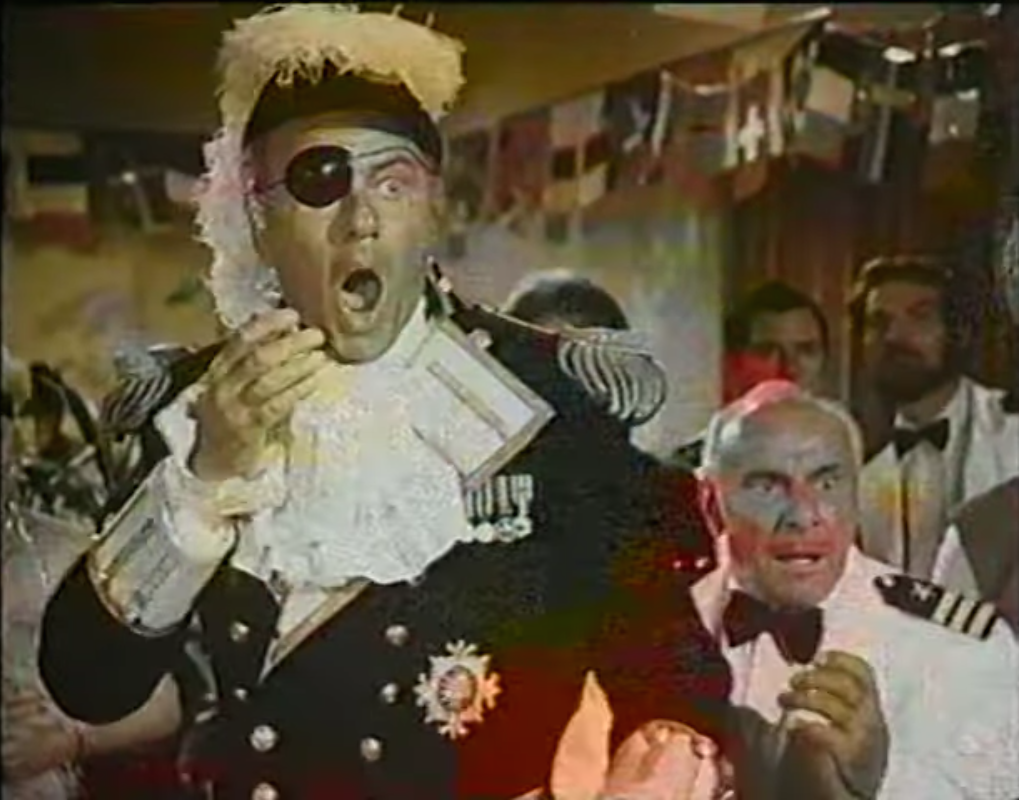 Harvey Korman about to take a cake in the face in Herbie Goes Bananas